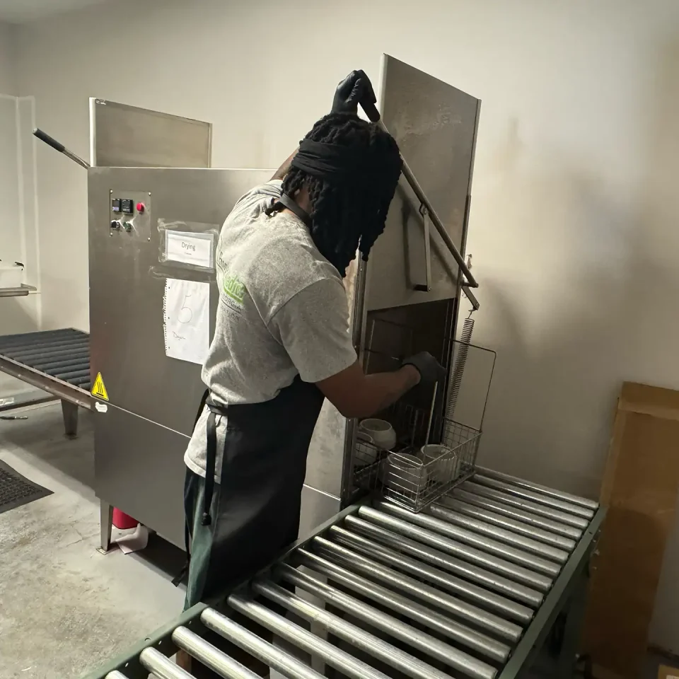 Contents Cleaning & Pack-Outs - Property Medics of Georgia A workers rinsing dishes