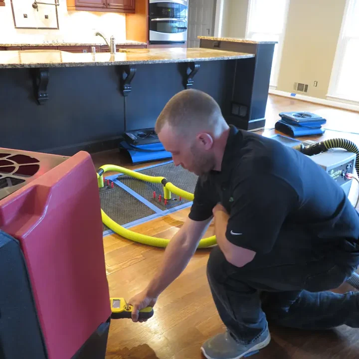 Water Damage Restoration - Property Medics of Georgia a man with water mitigation equipment